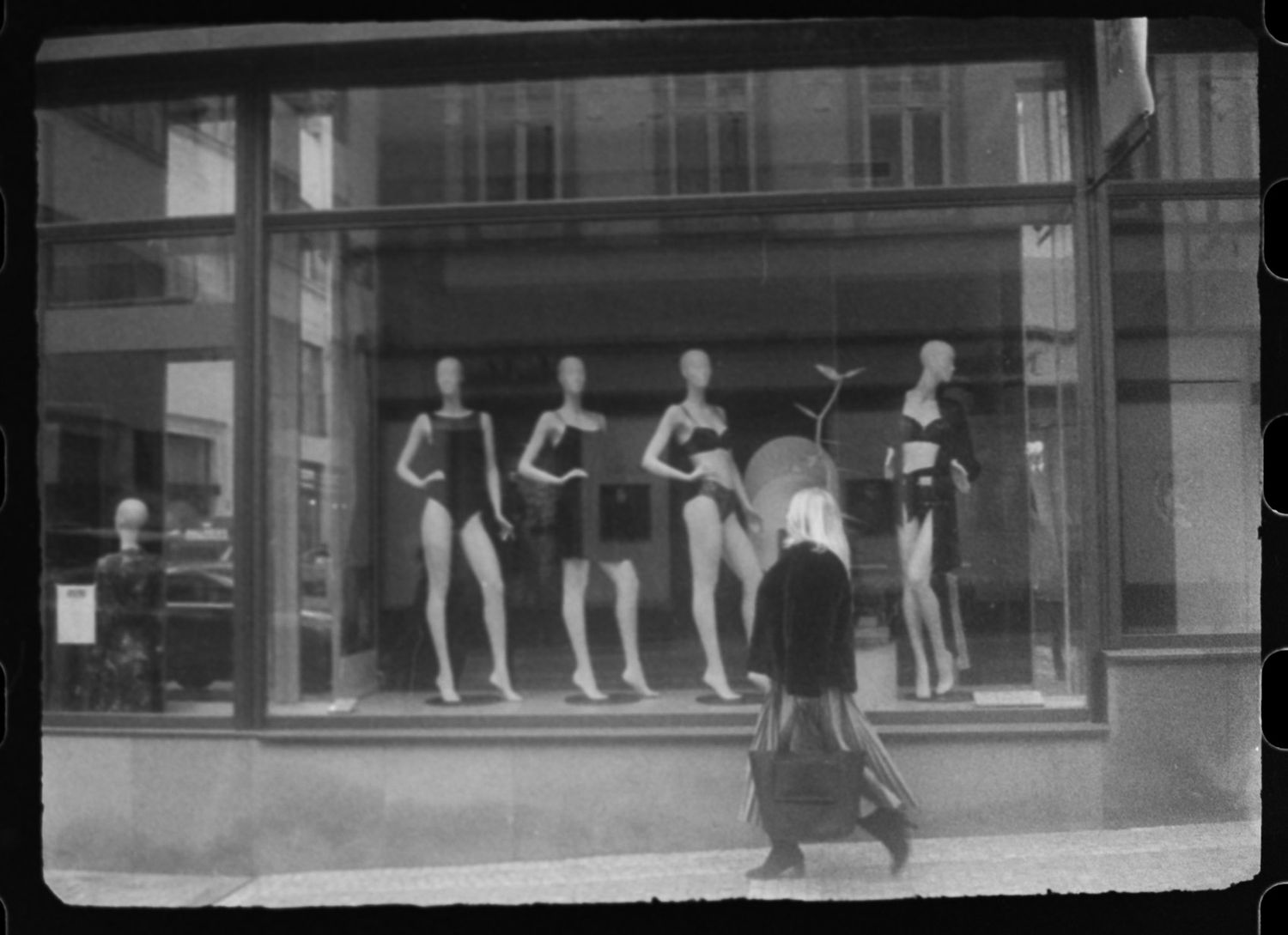 Analog photo woman in front of boutique