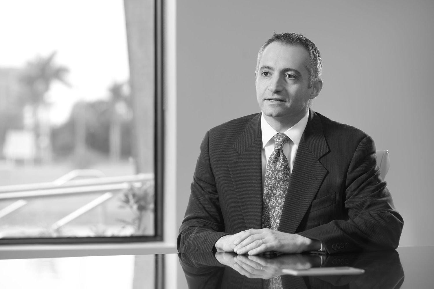 On-location headshot photographer Tampa Bay — executive coach portrait in conference room