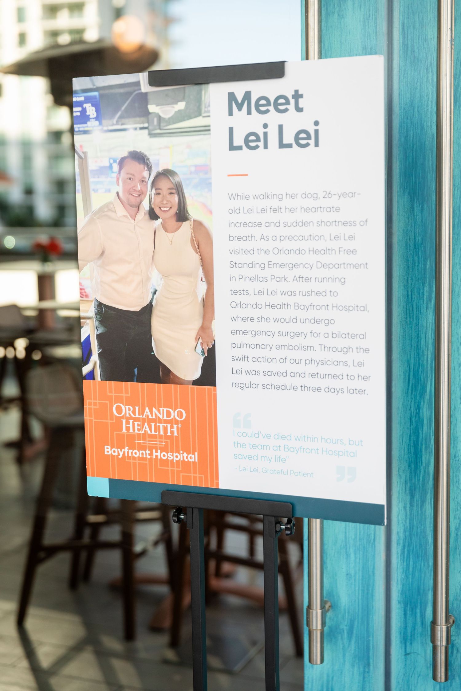 Orlando Health Bayfront Hospital Meet Lei Lei patient story display sign on an easel at a medical event.