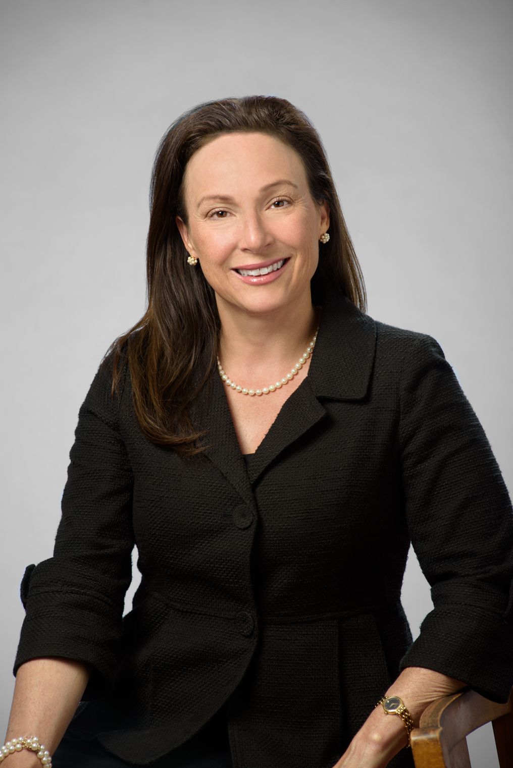 Professional headshot St. Petersburg FL — insurance agent against gray backdrop