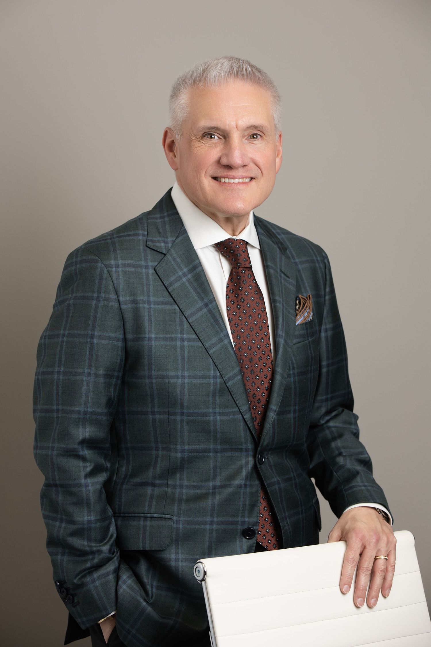 Corporate headshot photography St. Pete FL — sales director, confident studio pose