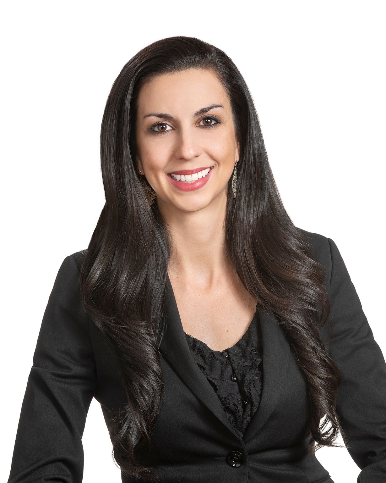 Professional headshot of a smiling woman with long dark hair wearing a black blazer against a white background.