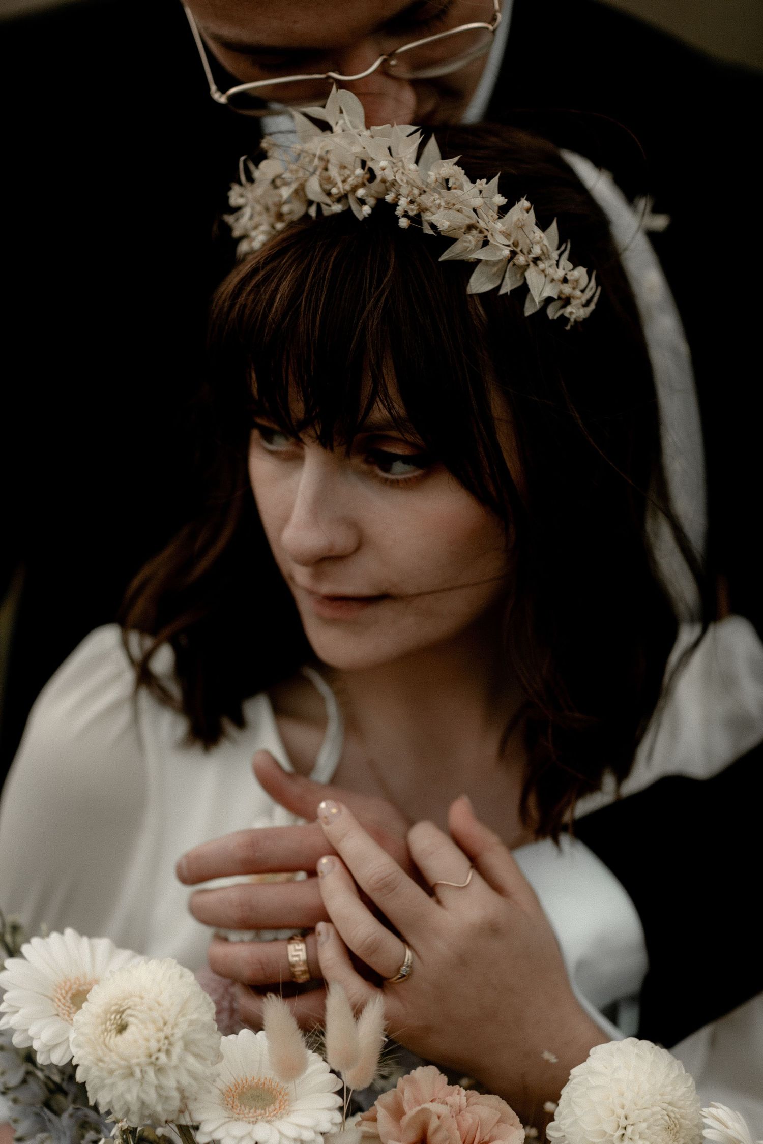 Dreamy bridal portrait featuring a delicate floral crown and vintage-inspired dress.