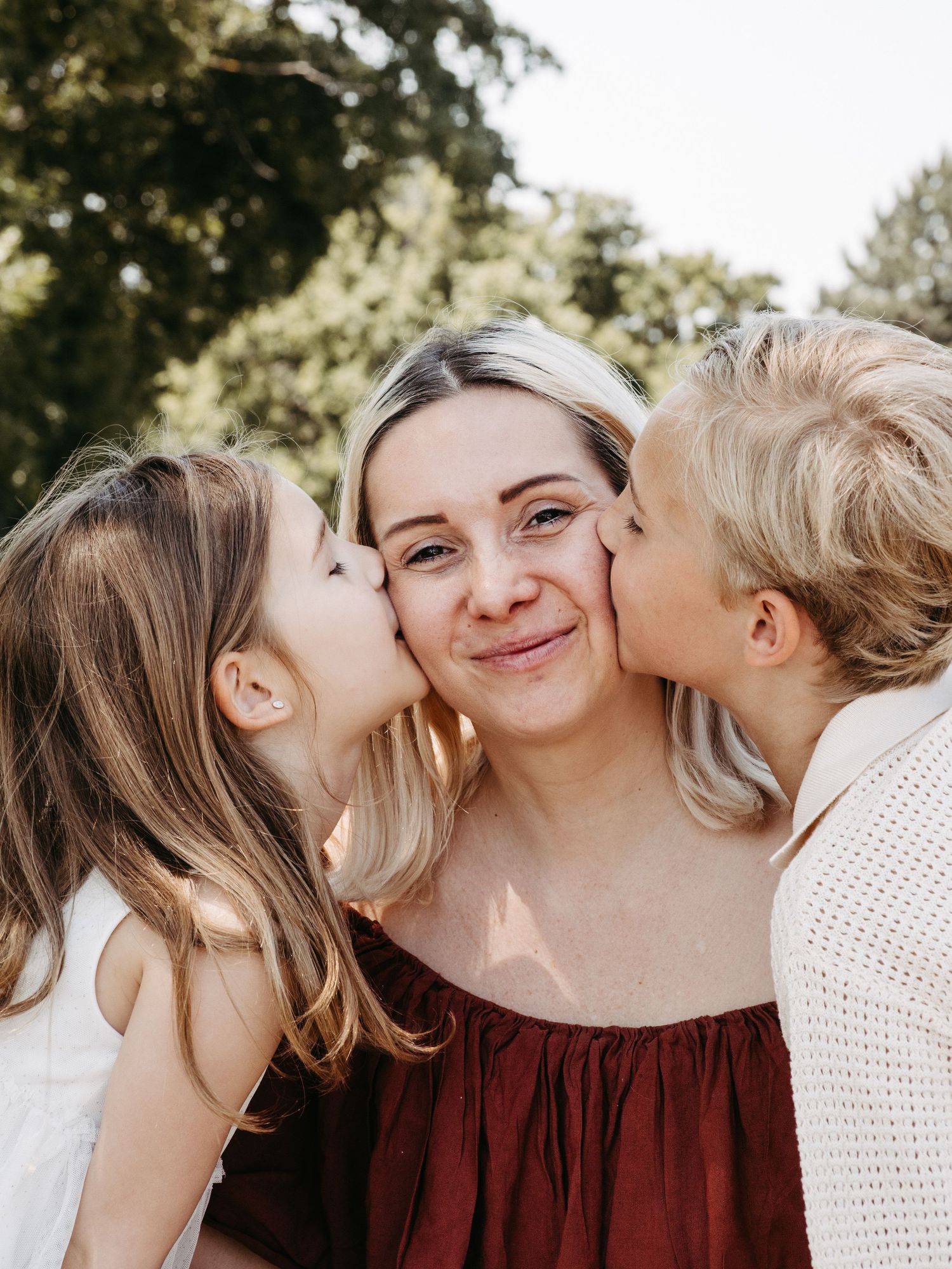 Sweet family portrait session showing tender moments of affection and laughter.