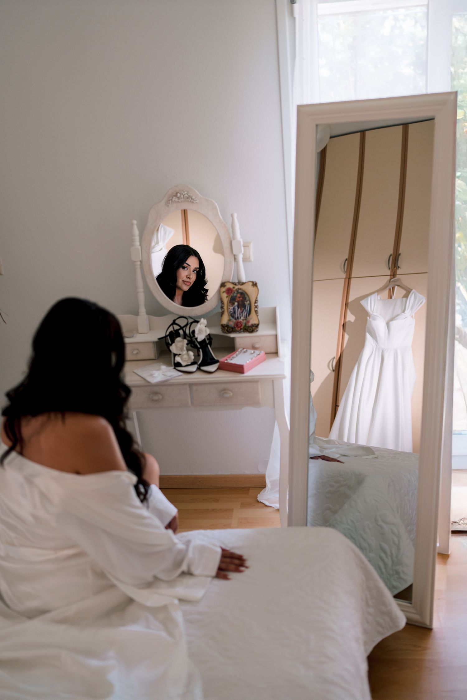 Sequence of morning preparation shots in a bright white bedroom.