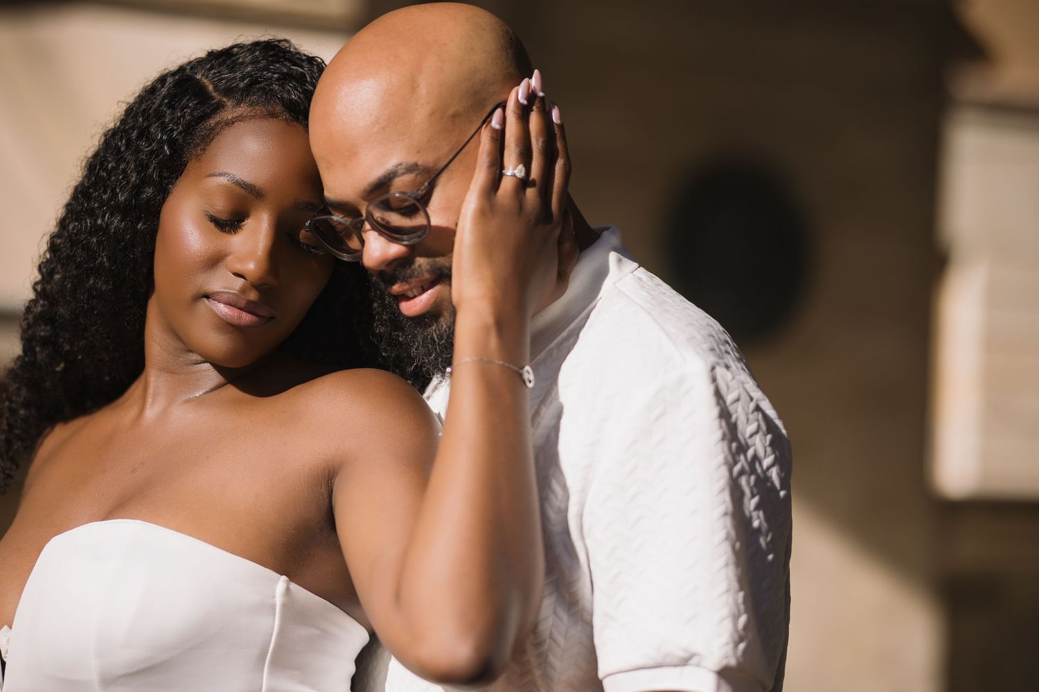 Romantic wedding portrait showing gentle interaction between newlyweds.
