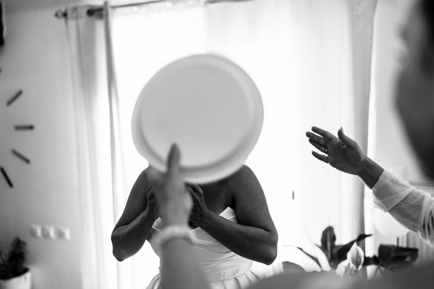 Black and white silhouettes of wedding guests in celebratory poses.
