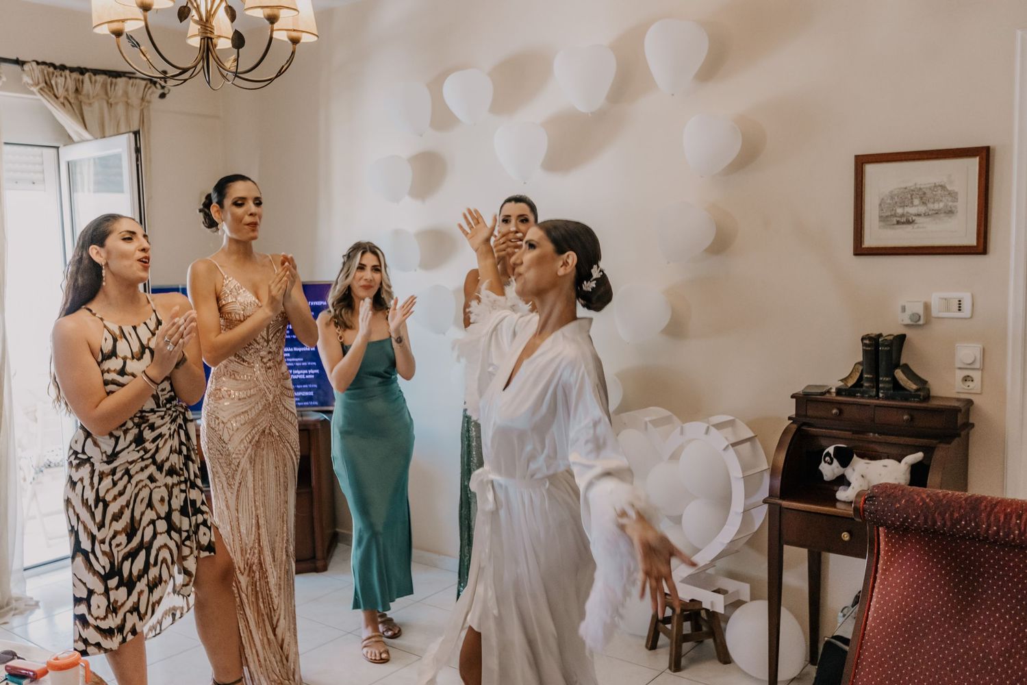 Wedding preparation scene with people getting ready in elegant room.
