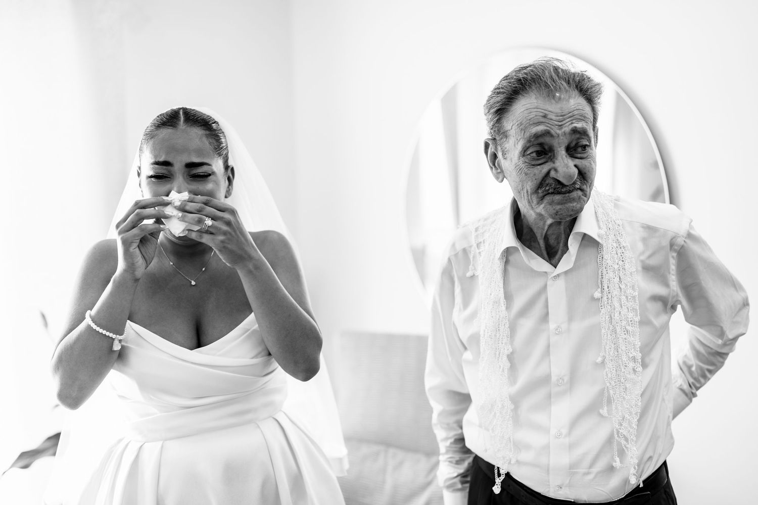 Series of candid black and white getting ready moments on wedding day.