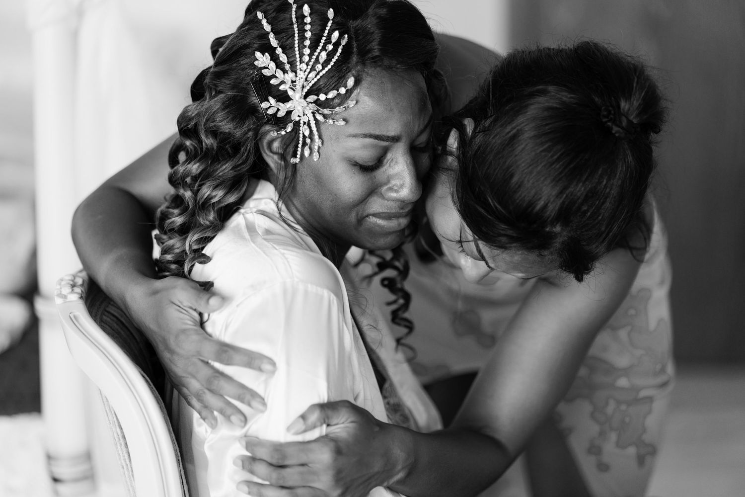 Black and white wedding preparation photos capturing intimate moments of getting ready.