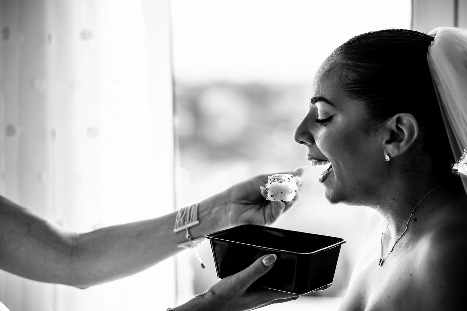 Black and white getting ready moments captured in natural window light.