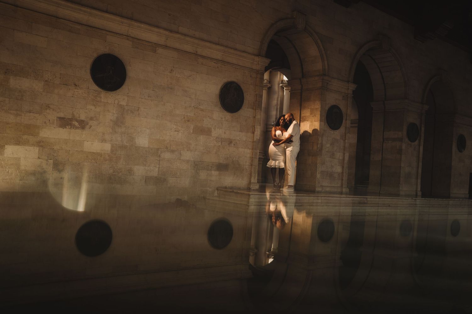 Wedding venue interior with stone architecture and dramatic lighting.