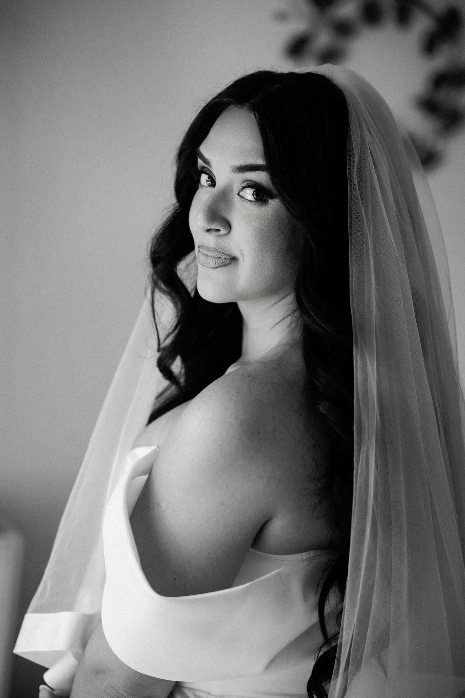 Black and white bridal portraits with dramatic side lighting and veil details.