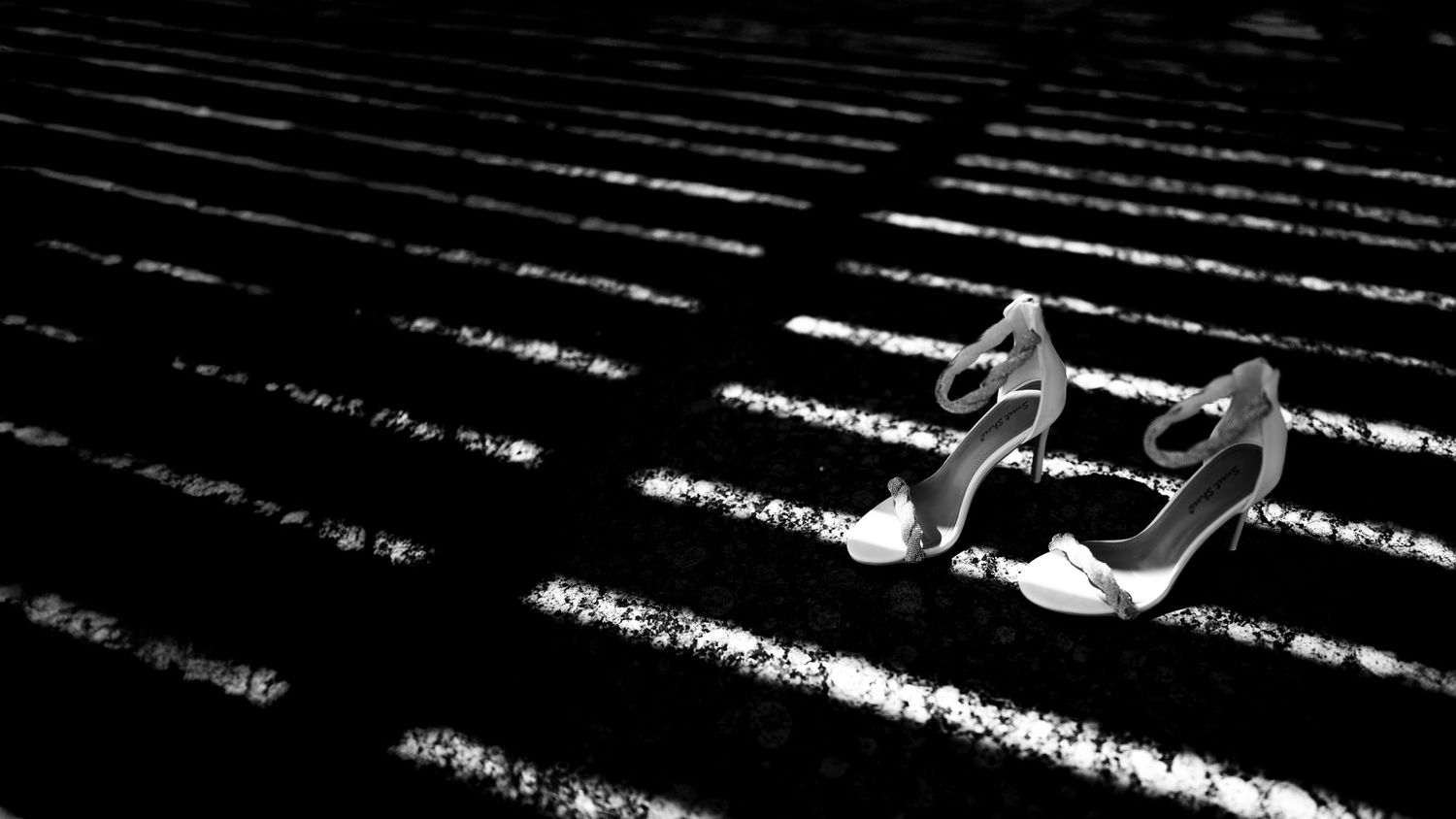 Abstract black and white pattern of parallel lines creating a geometric texture.
