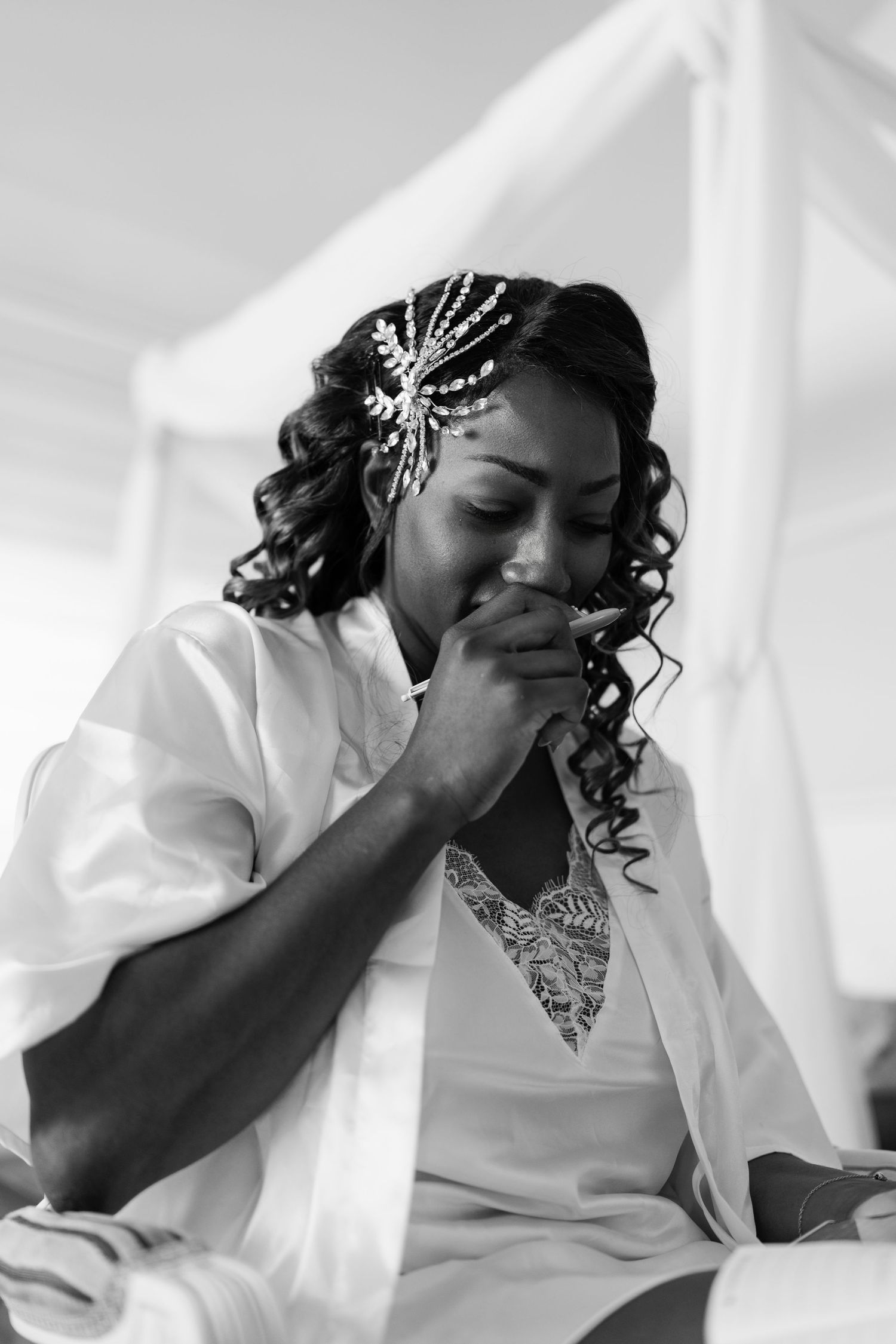 Candid moment during bridal preparations showing detailed hair accessories.