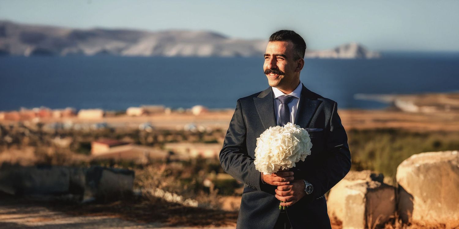 Scenic coastal wedding photography with Mediterranean landscape and ocean views.