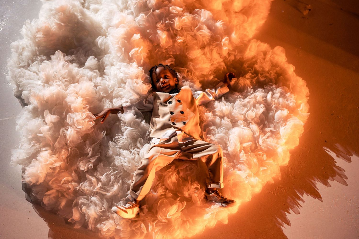 Orange smoke effects create a dramatic atmosphere on a dance floor.