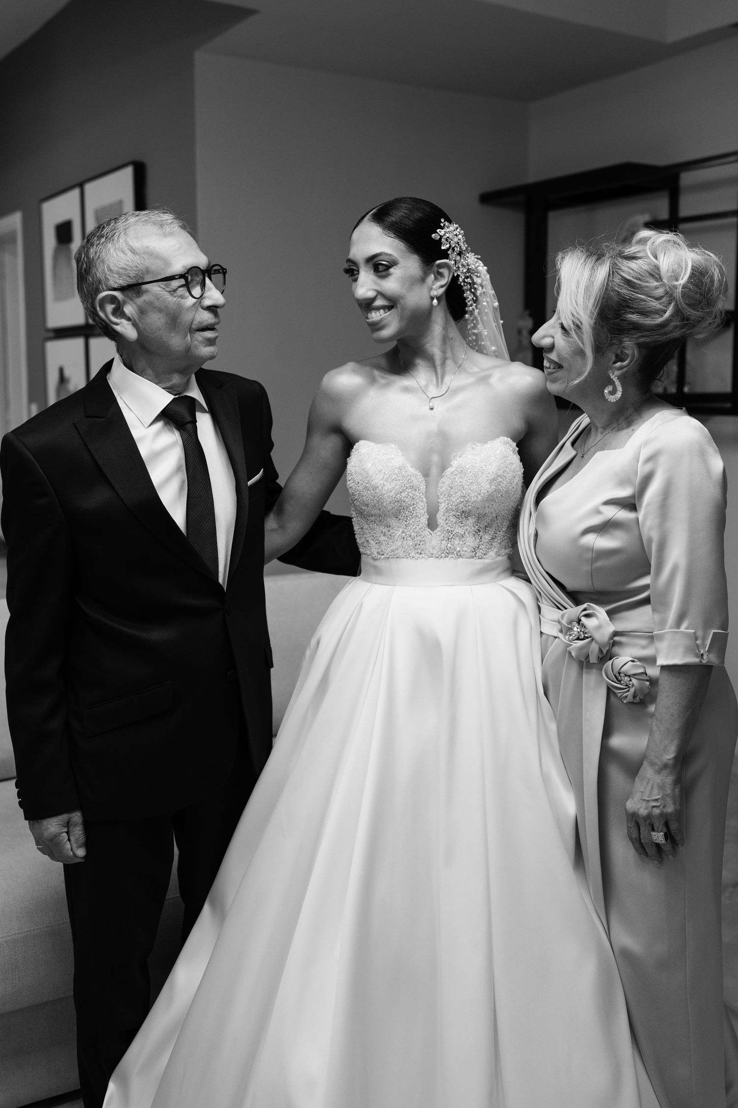 A wedding scene showing a beautiful bridal gown and formal attire.