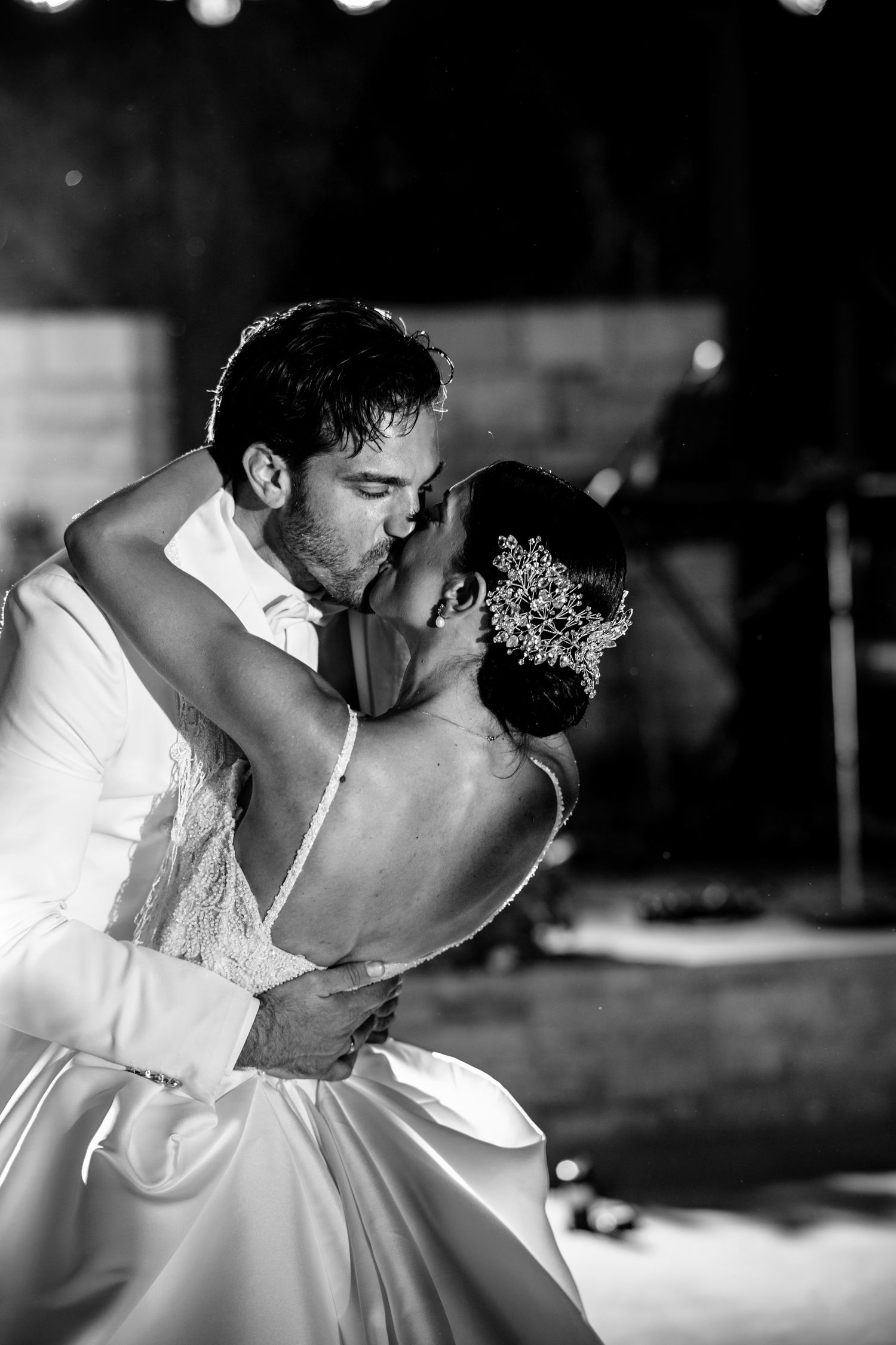 Intimate black and white portrait of a romantic wedding dance dip.