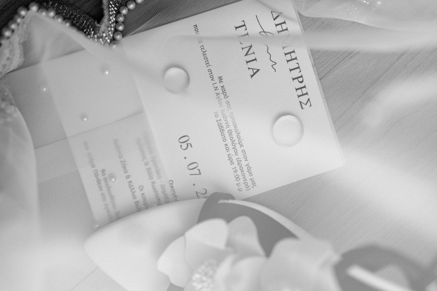 Close-up shots of papers and documents laying on white bedding.