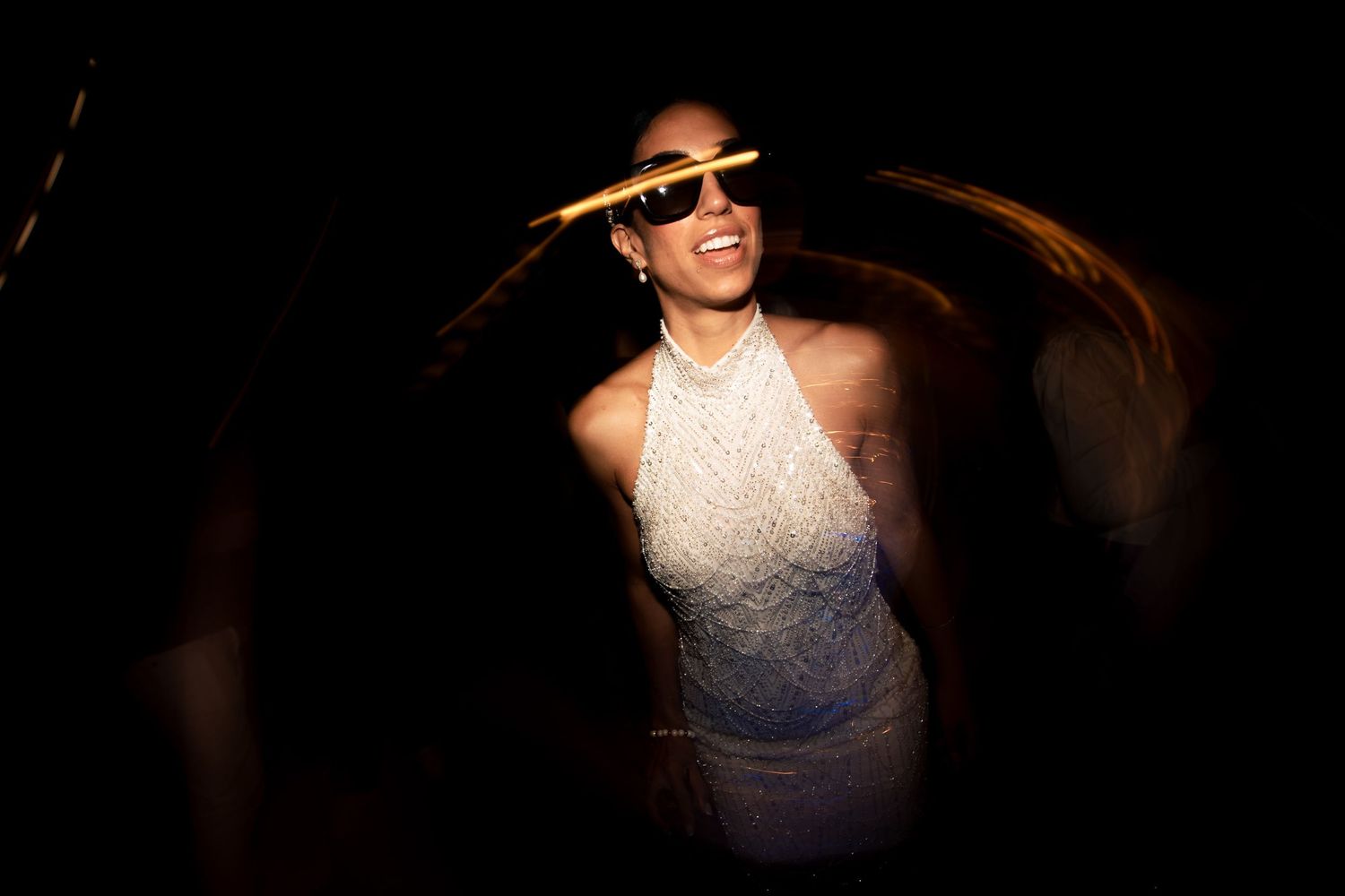 Dramatic low-light wedding photography with artistic composition.