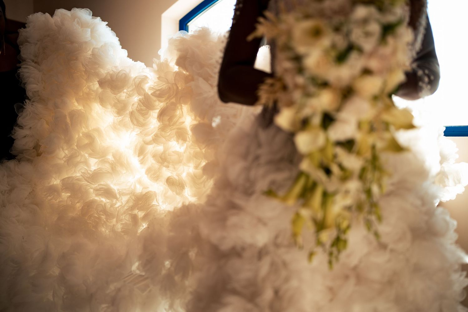 Artistic close-up of white wedding flowers and decorative elements.