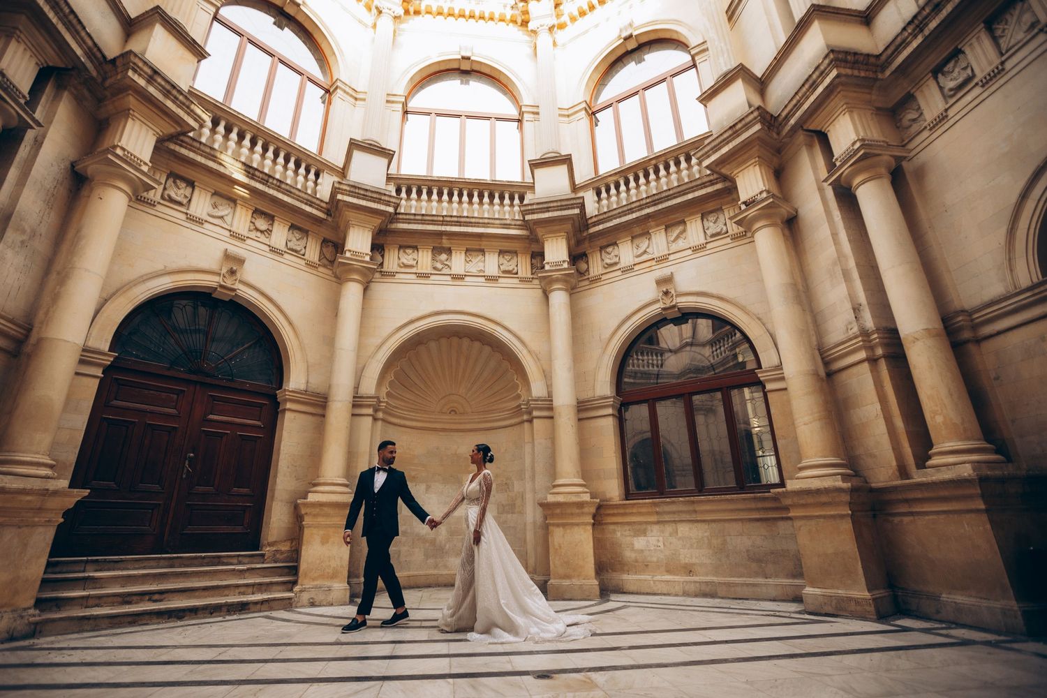 Panoramic view of elegant marble rotunda interior with ornate architectural details.