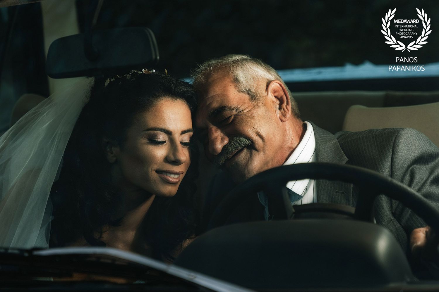 Intimate moments captured inside a classic car with dramatic lighting.