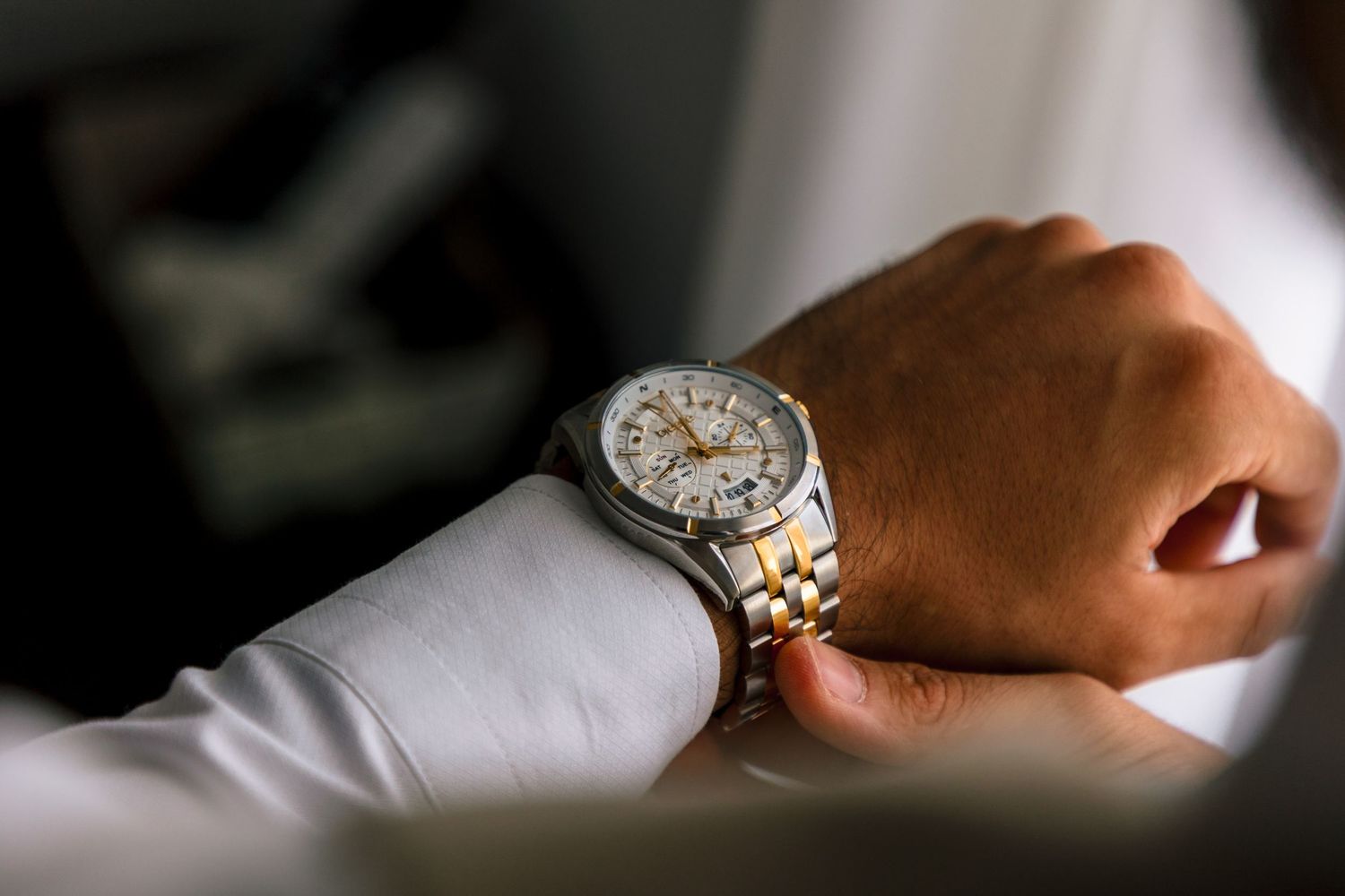 Close-up of luxury watches and jewelry details in soft natural light.