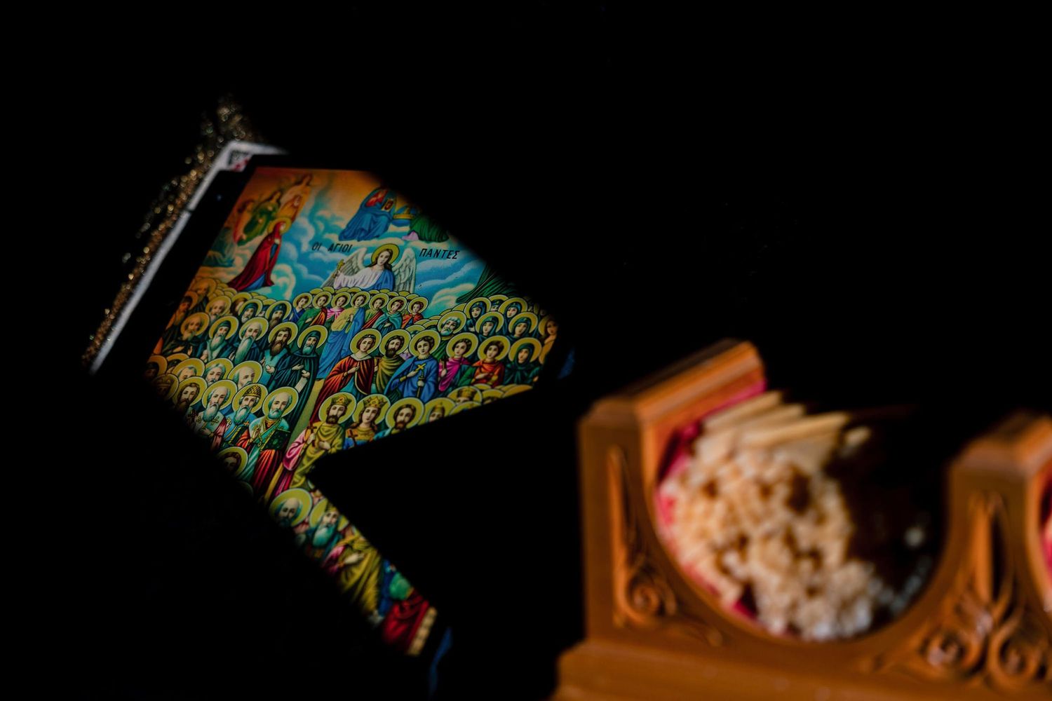 Artistic close-up shots of ornate religious text with colorful illuminated details.
