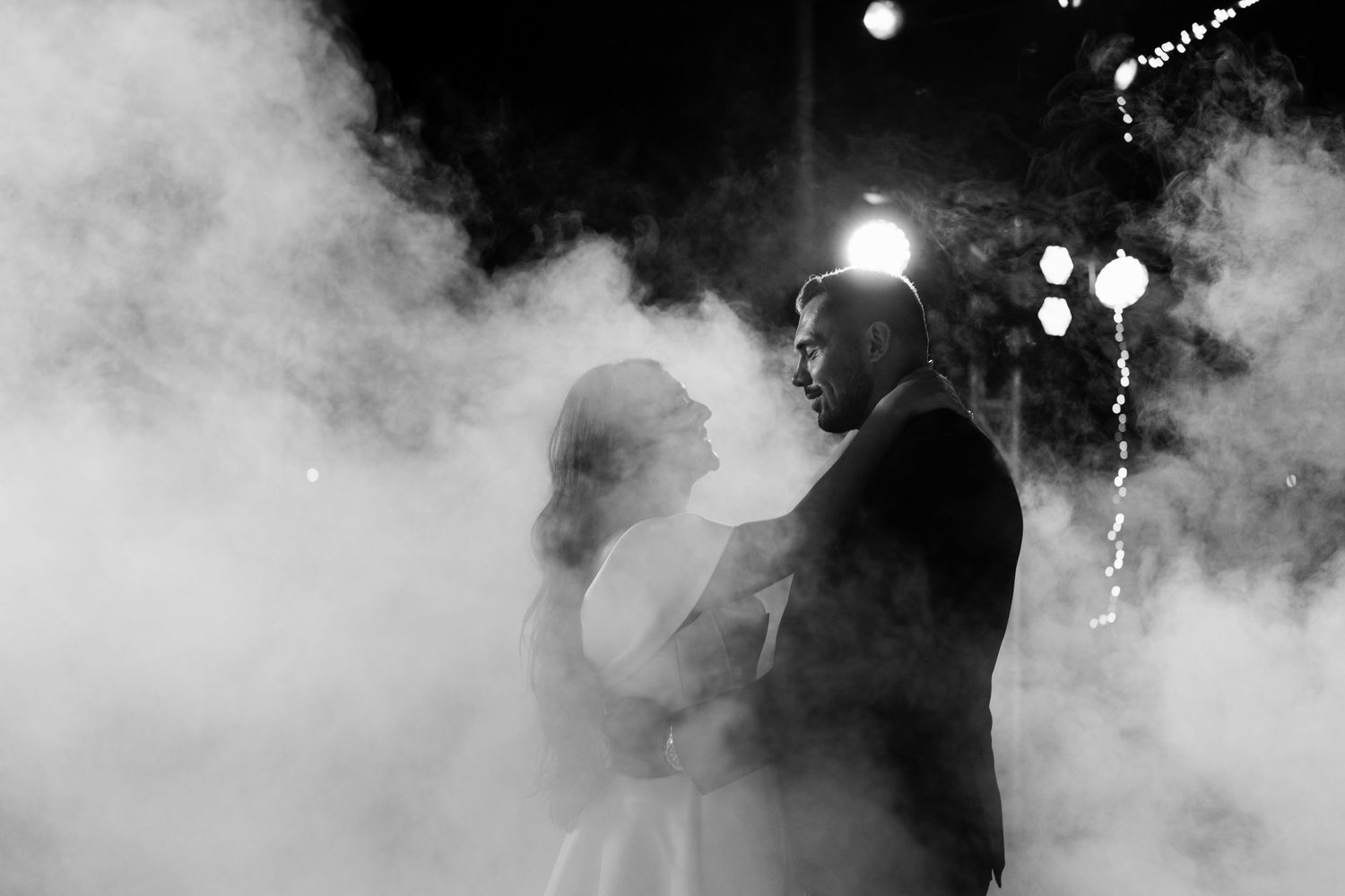 Atmospheric dance floor scene with fog and dramatic blue lighting effects.