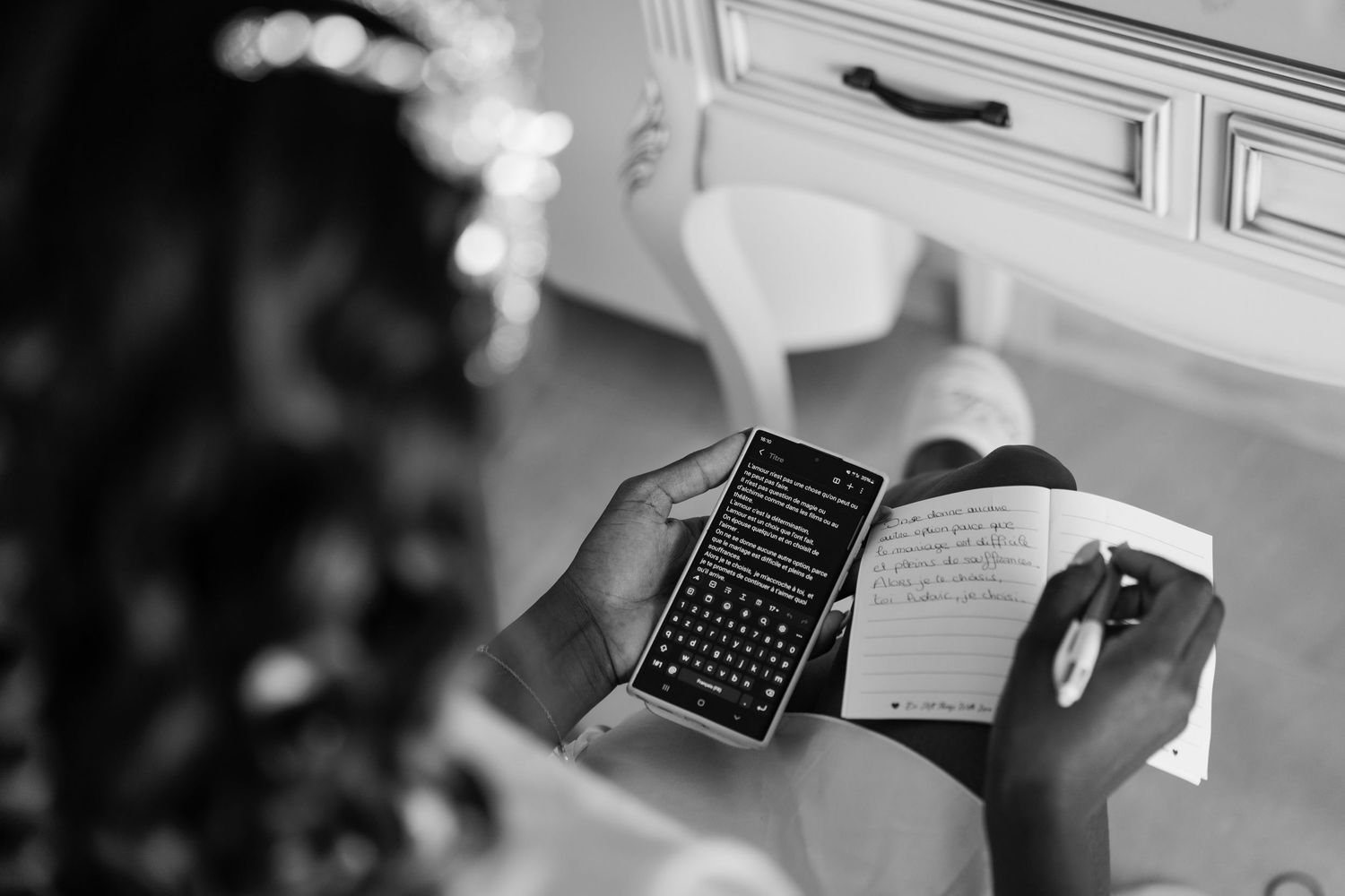 Wedding preparation moments show hands holding phones and documents in black and white.