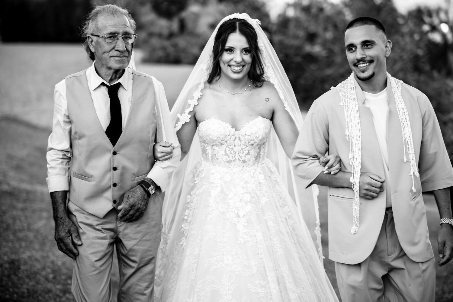 Black and white wedding party portrait with the wedding couple and attendants.