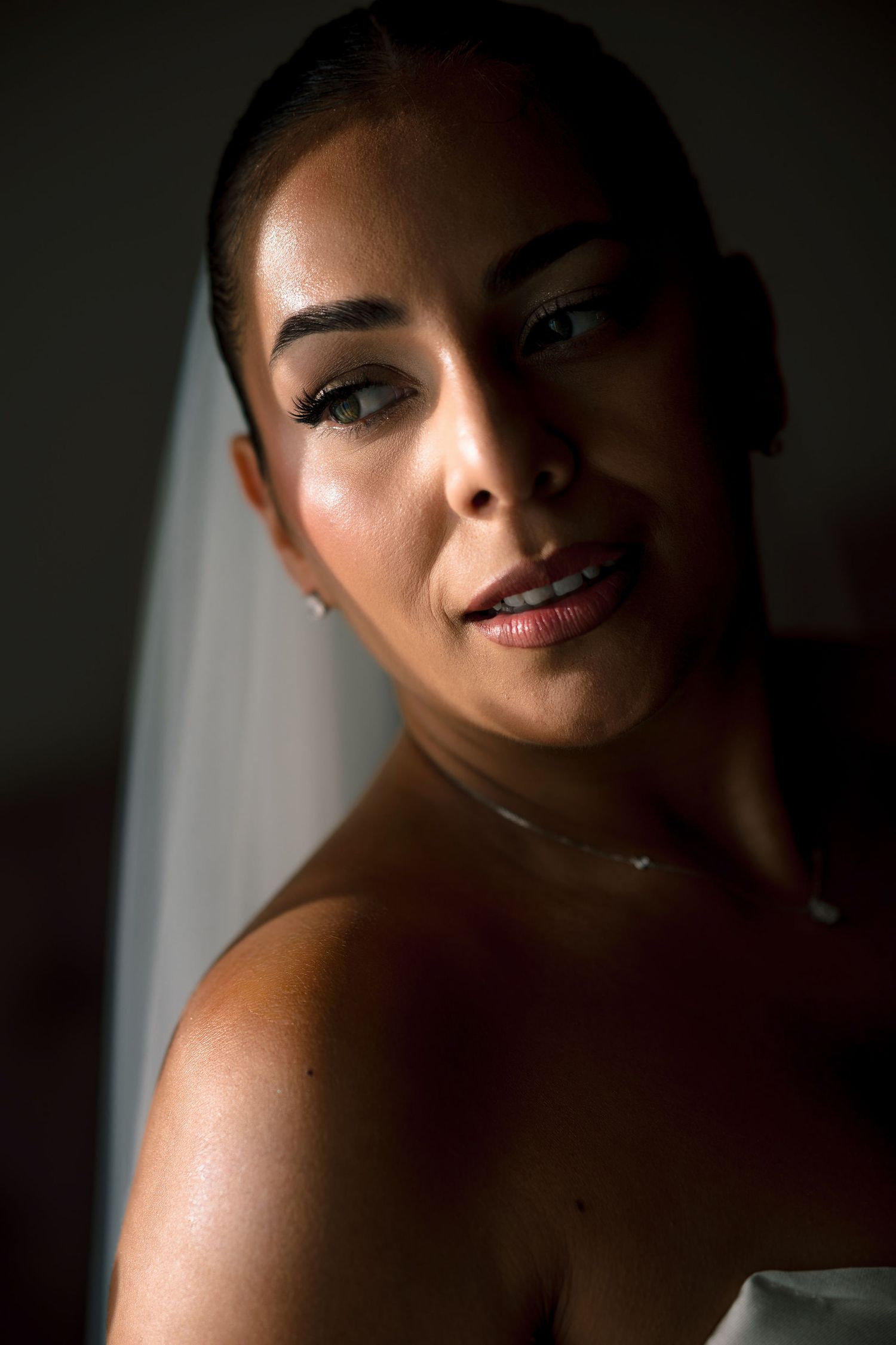 Artistic close-up portraits with dramatic lighting and shadows.