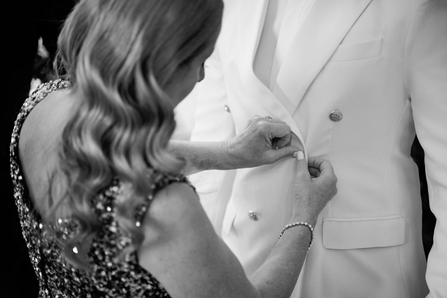 Elegant wedding party members in formal attire prepare for the ceremony.