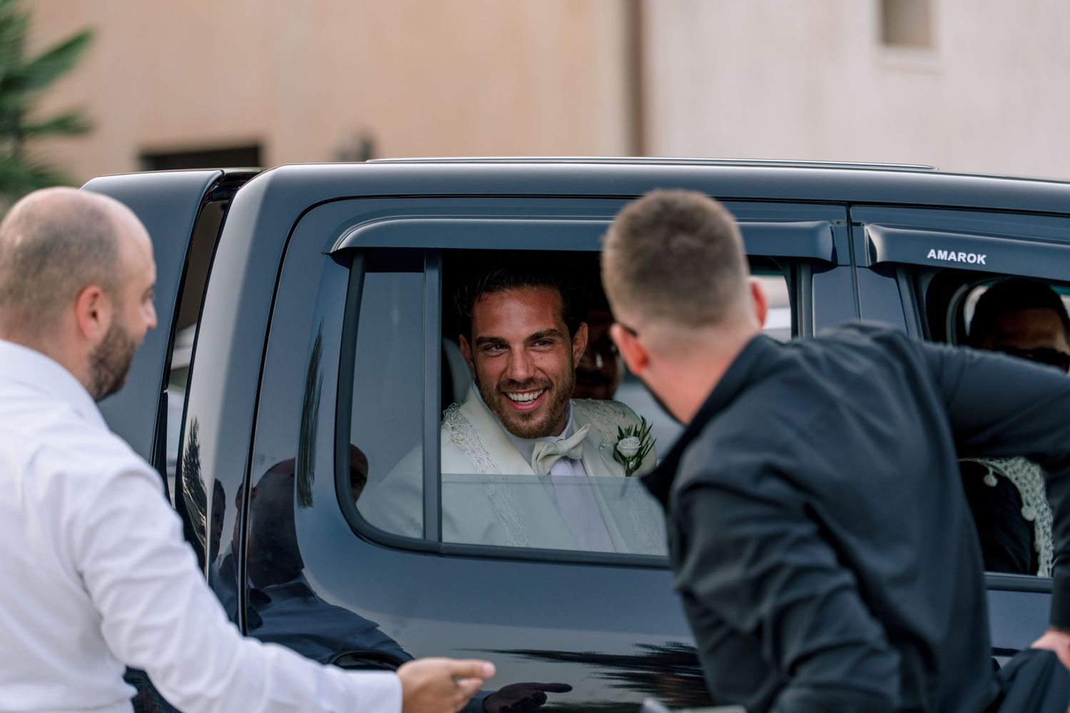 A casual moment captured through a truck window at an outdoor event.