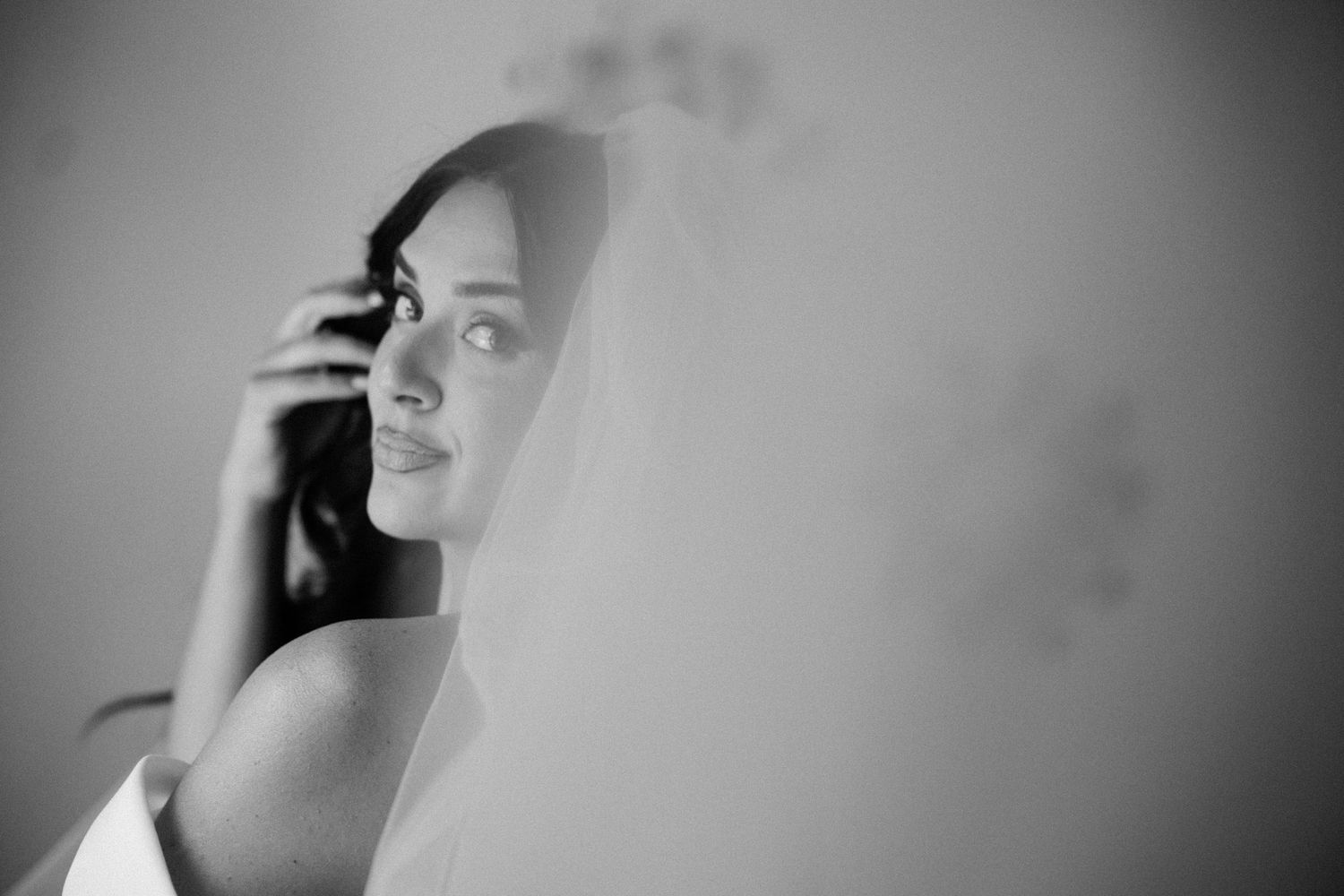Artistic black and white portrait shots with dramatic lighting and shadows.