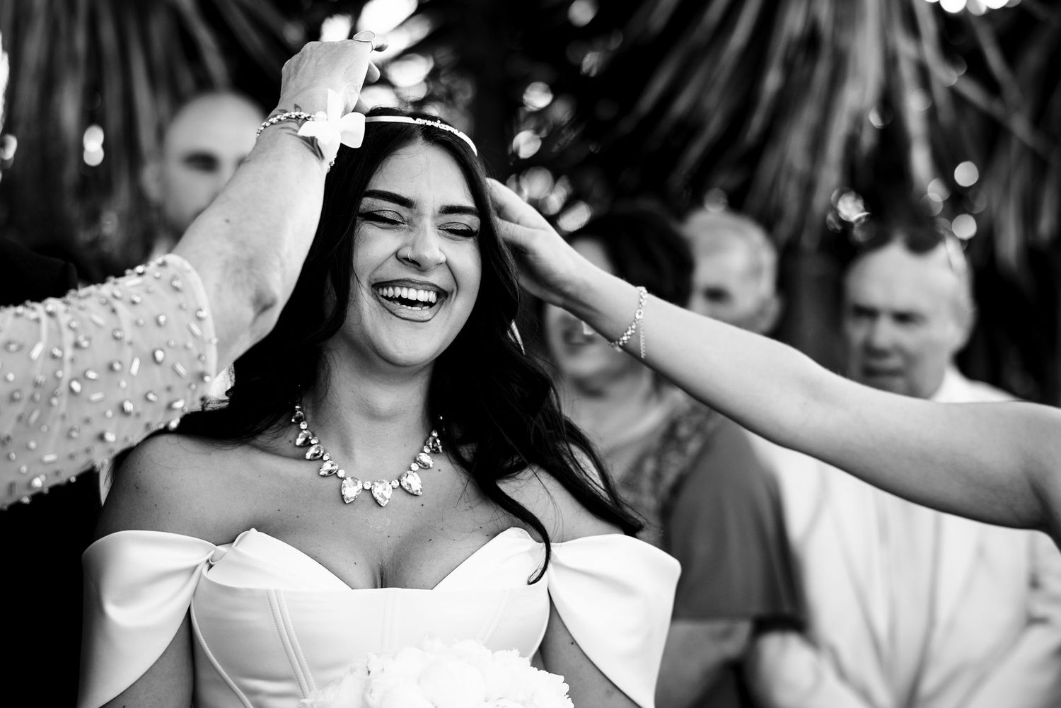 Black and white portraits of joyful wedding celebration moments.