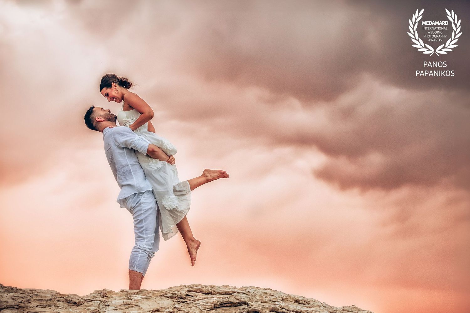 Romantic sunset wedding photos with couple silhouetted against pink and orange sky.