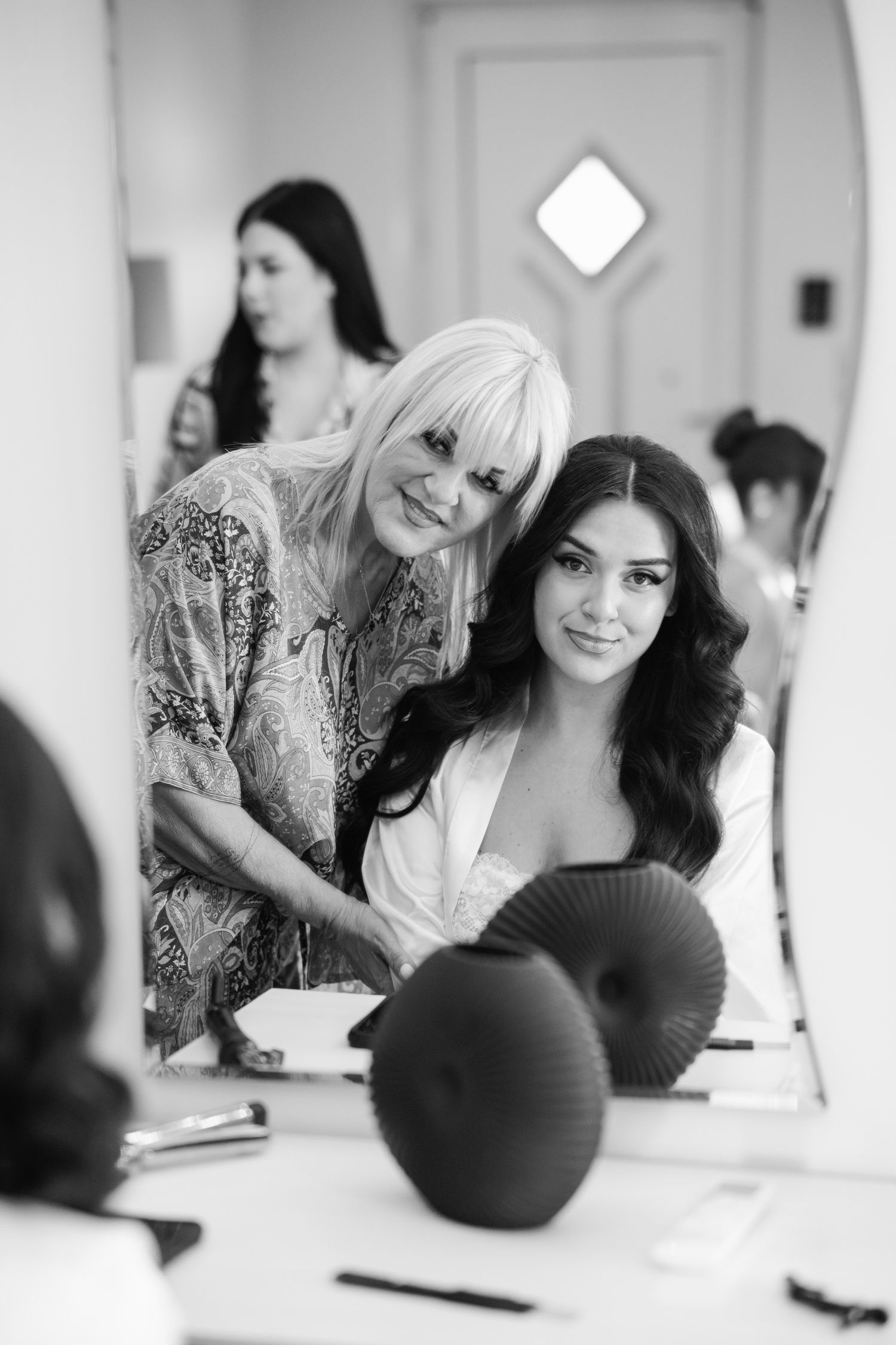 Wedding preparation scene with makeup brushes and styling tools.