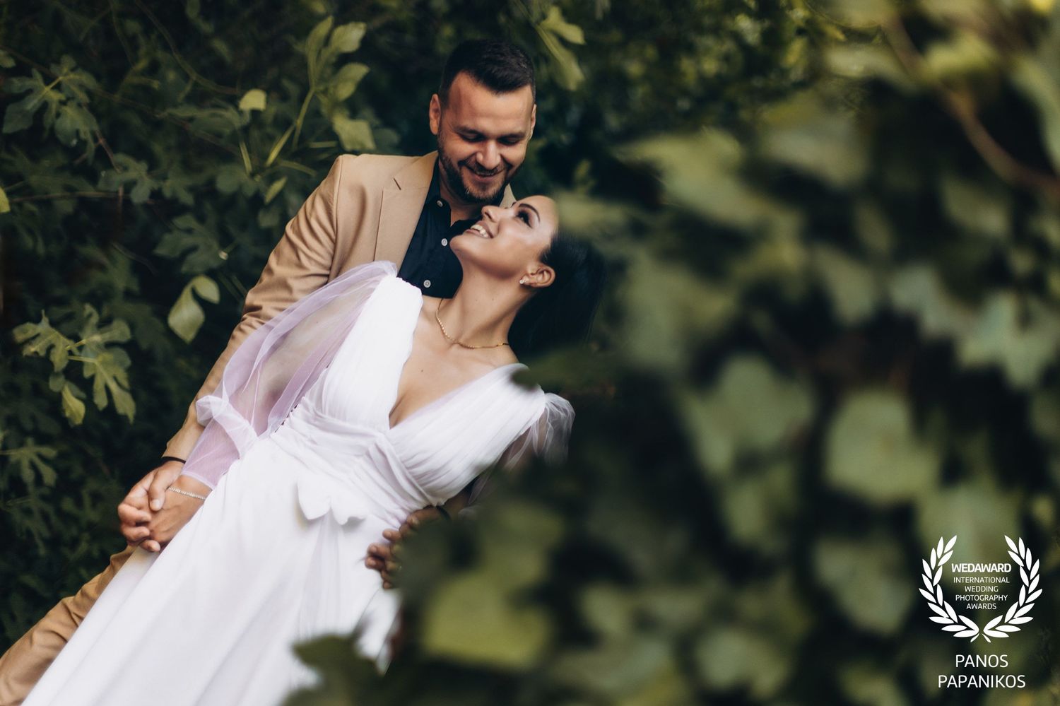 Romantic outdoor wedding photography in natural garden setting with soft lighting.