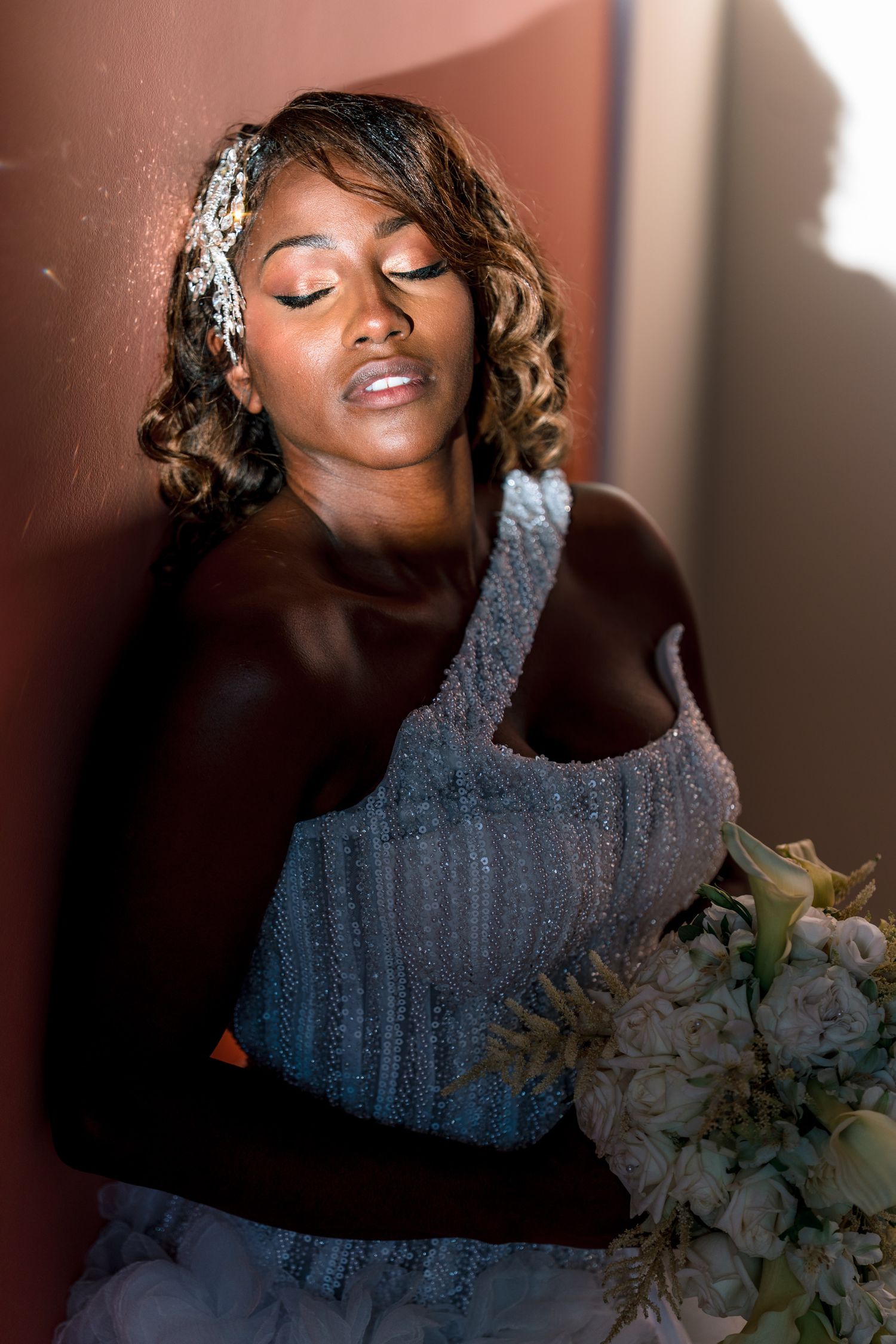 Dramatic bridal portrait with sparkling details and soft lighting.