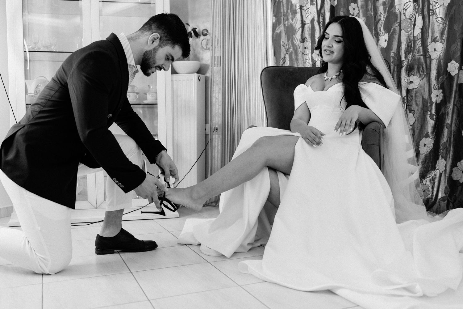 Wedding preparation sequence showing dress fitting and adjustments in natural light.