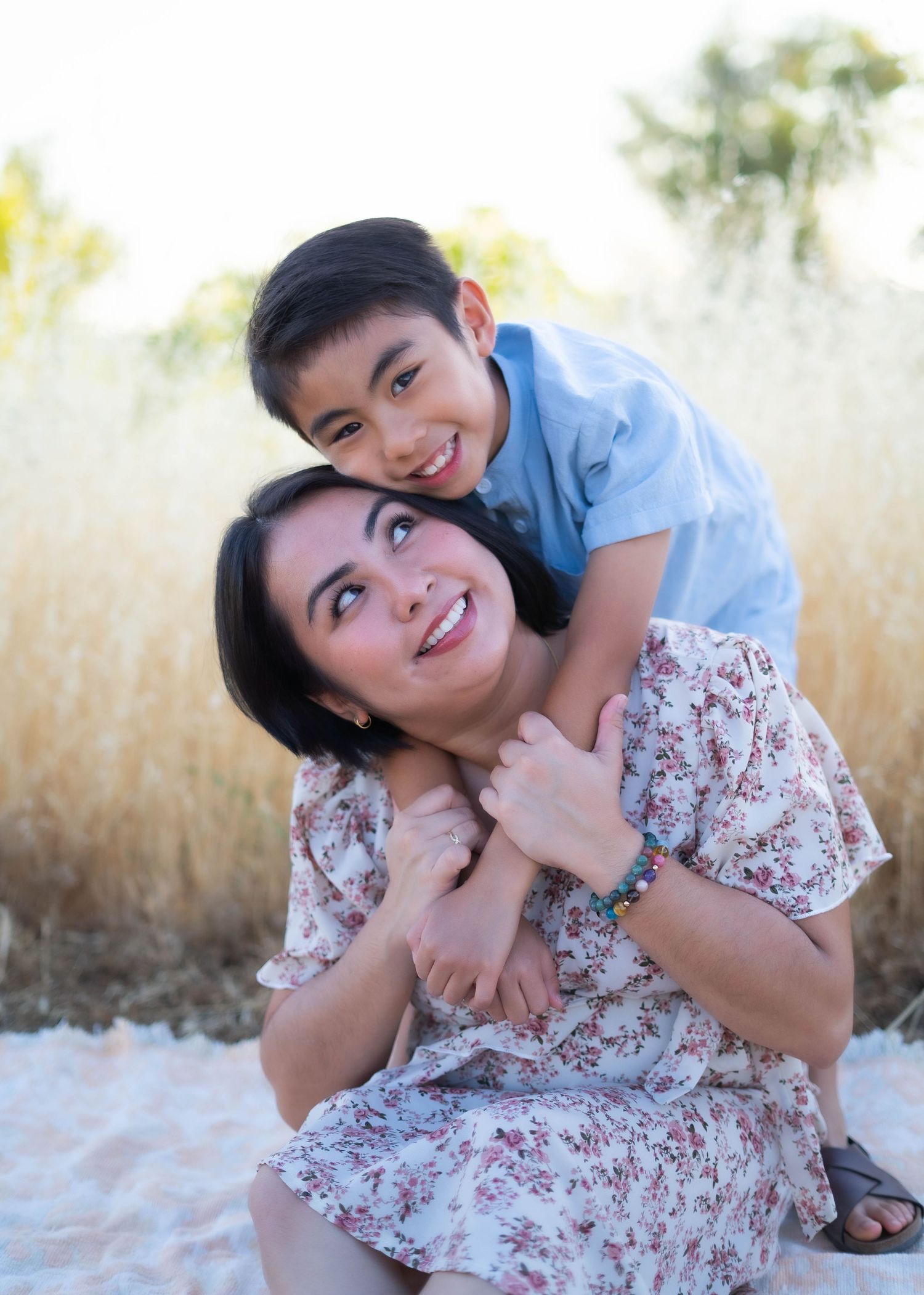 Mother and child sharing tender moments in a series of candid outdoor portraits.