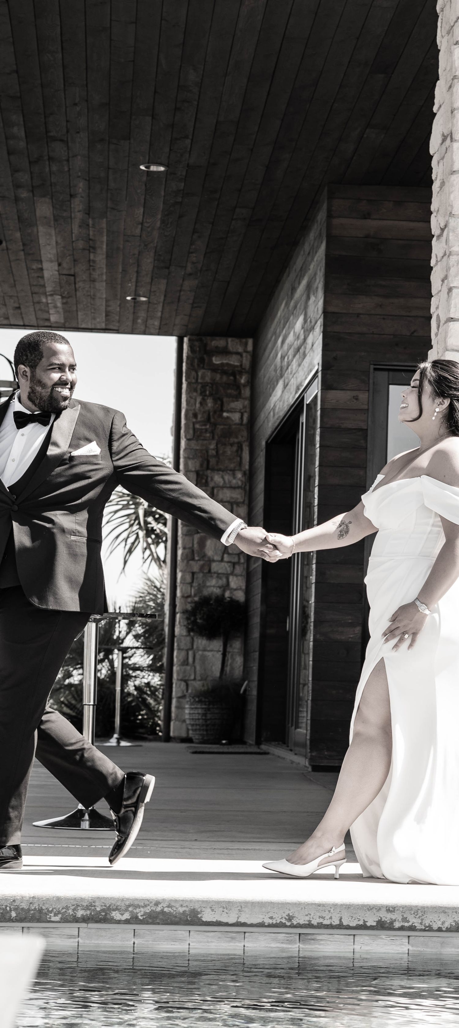 Artistic black and white sequence of a couple dancing near a pool.