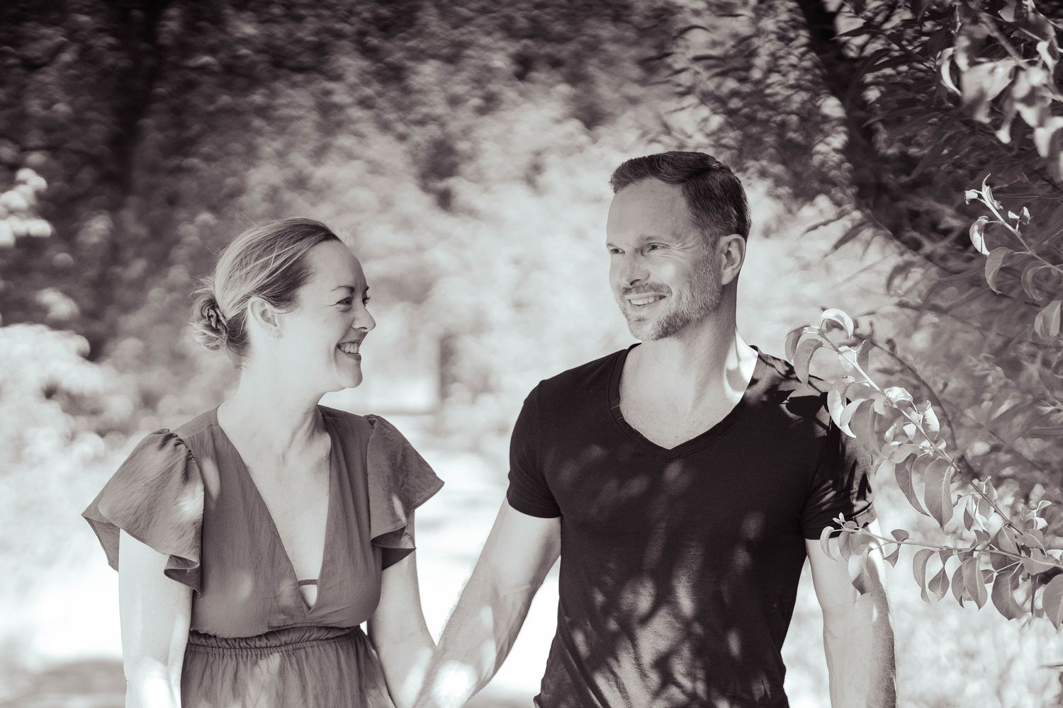 Black and white candid family moments captured on outdoor path.