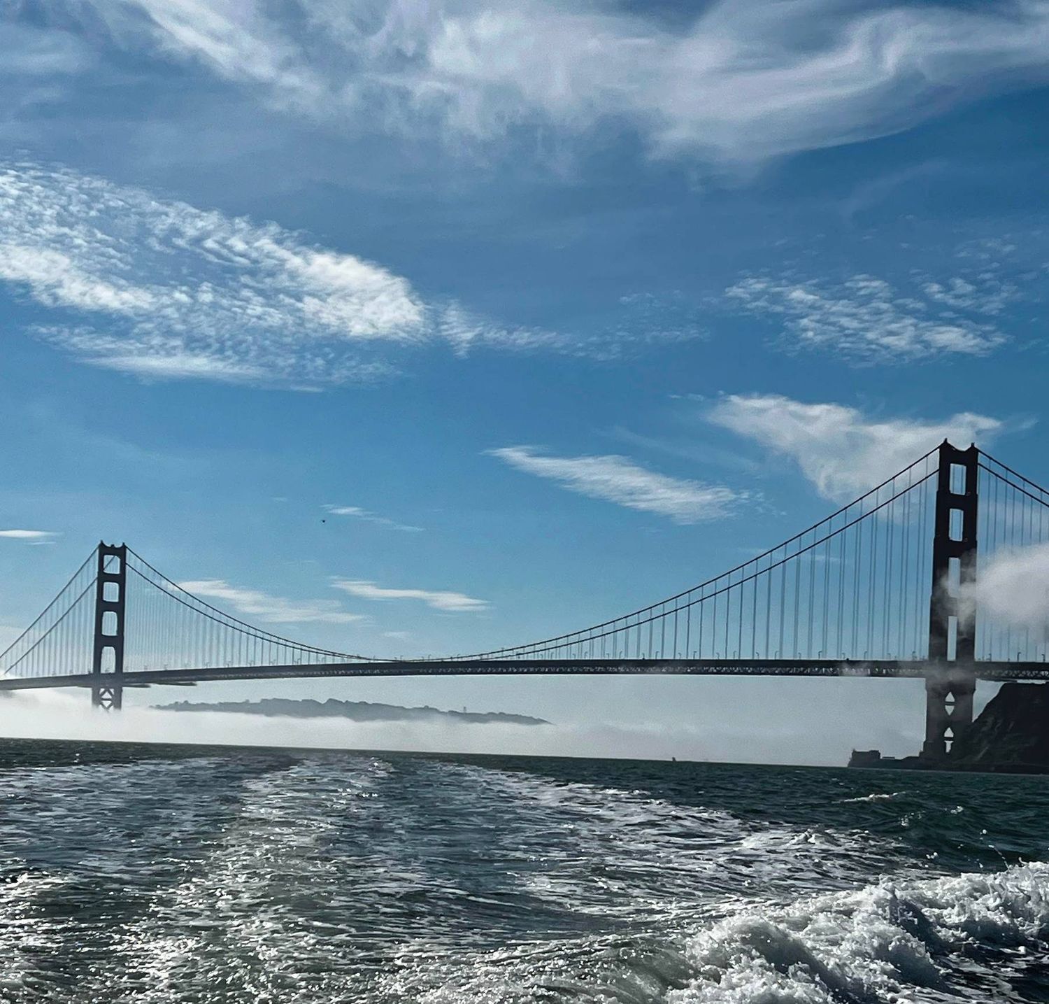 Panoramic view of the Golden Gate Bridge spanning across the San Francisco Bay.
