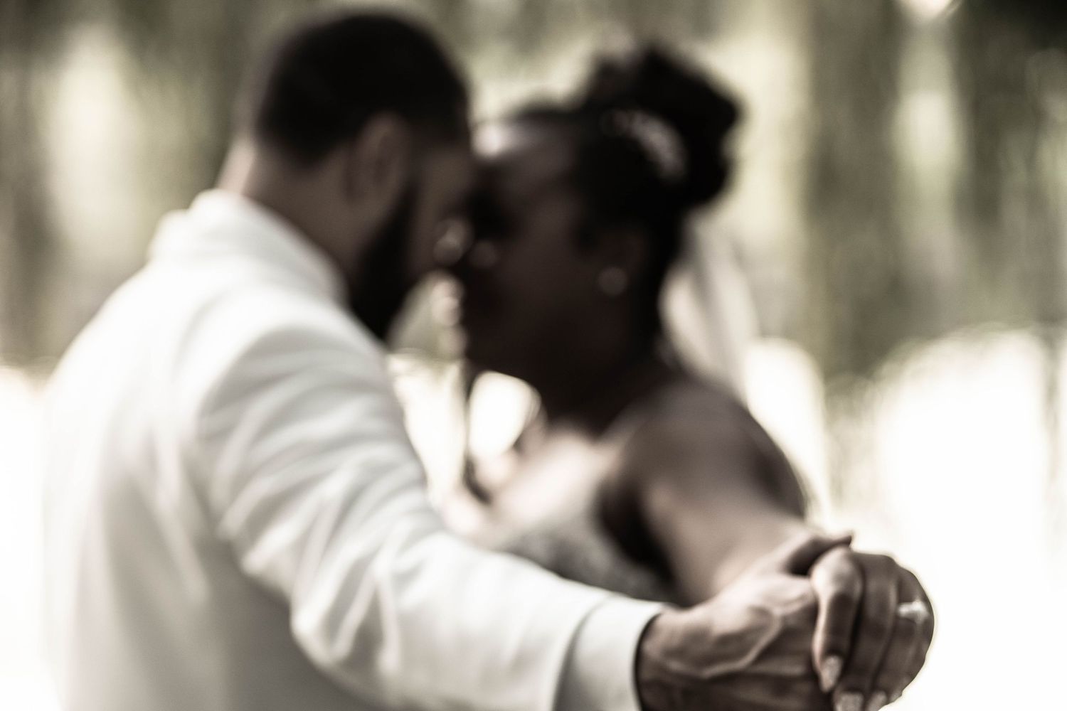 Black and white wedding portraits capturing intimate moments.