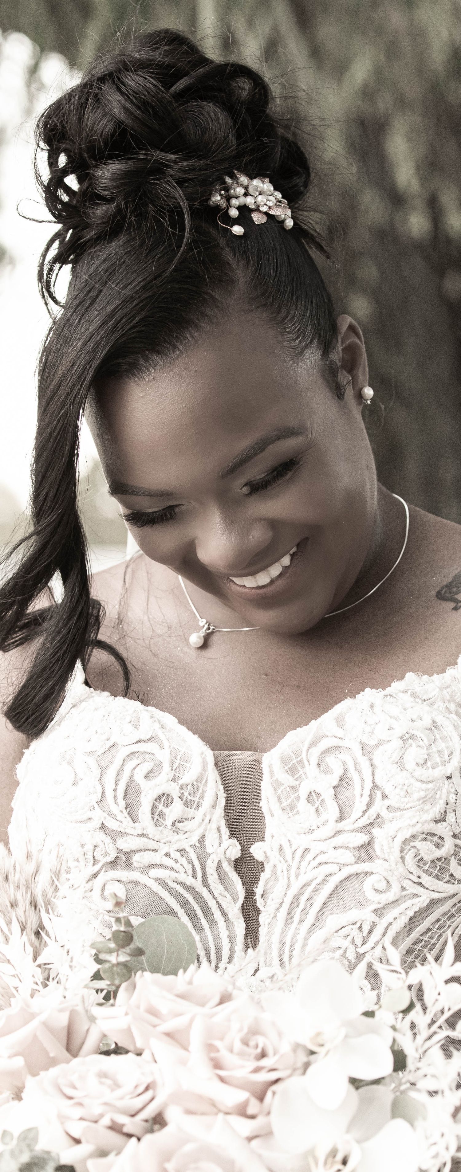 Close-up portrait series showing a bride in delicate lace dress with floral hair accessories looking down with a gentle smile.