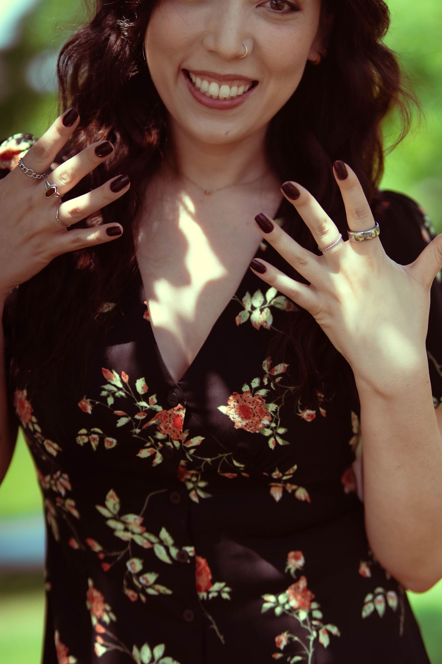 Close-up shots showing joyful expressions wearing floral print dress.
